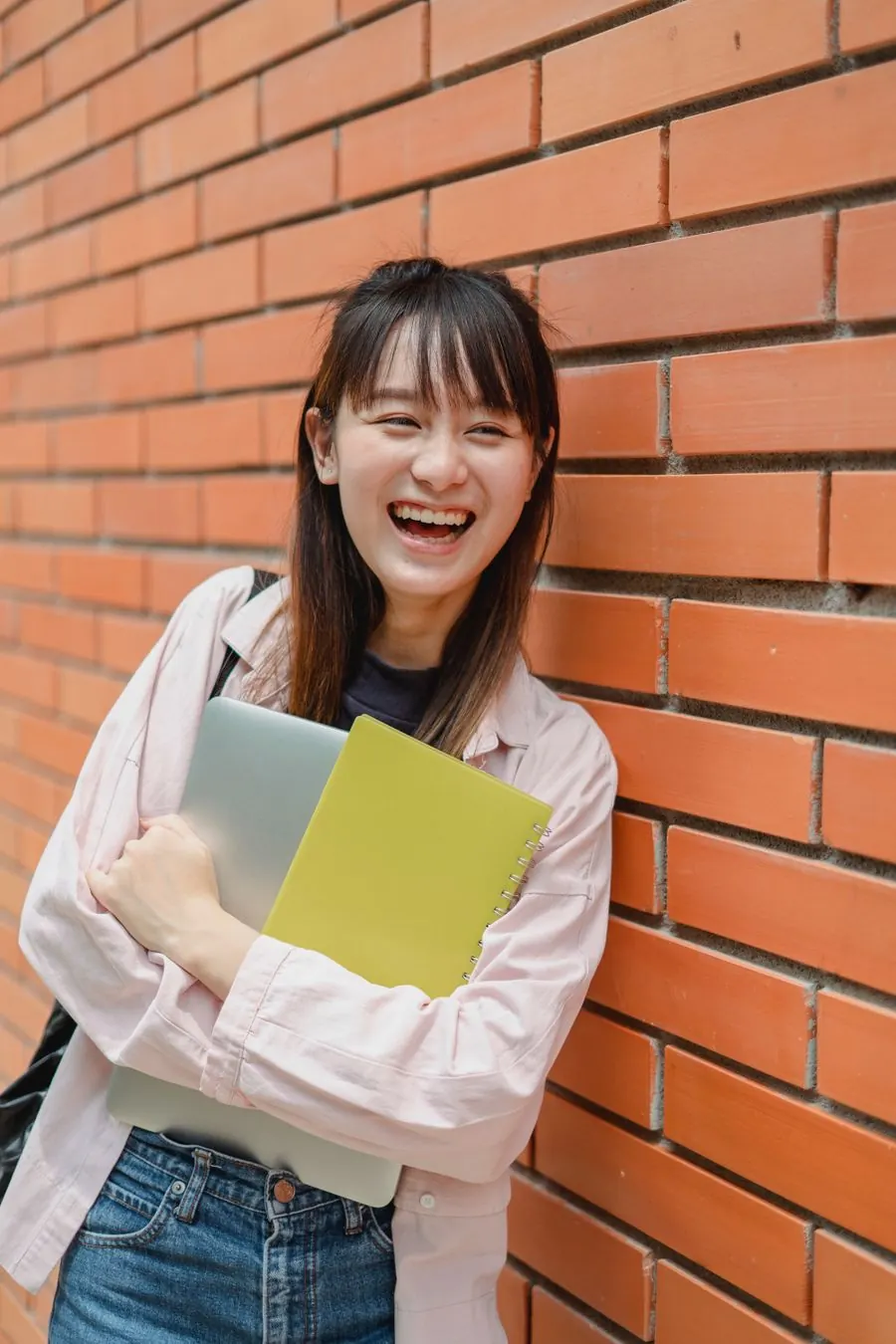 A university student with her laptop